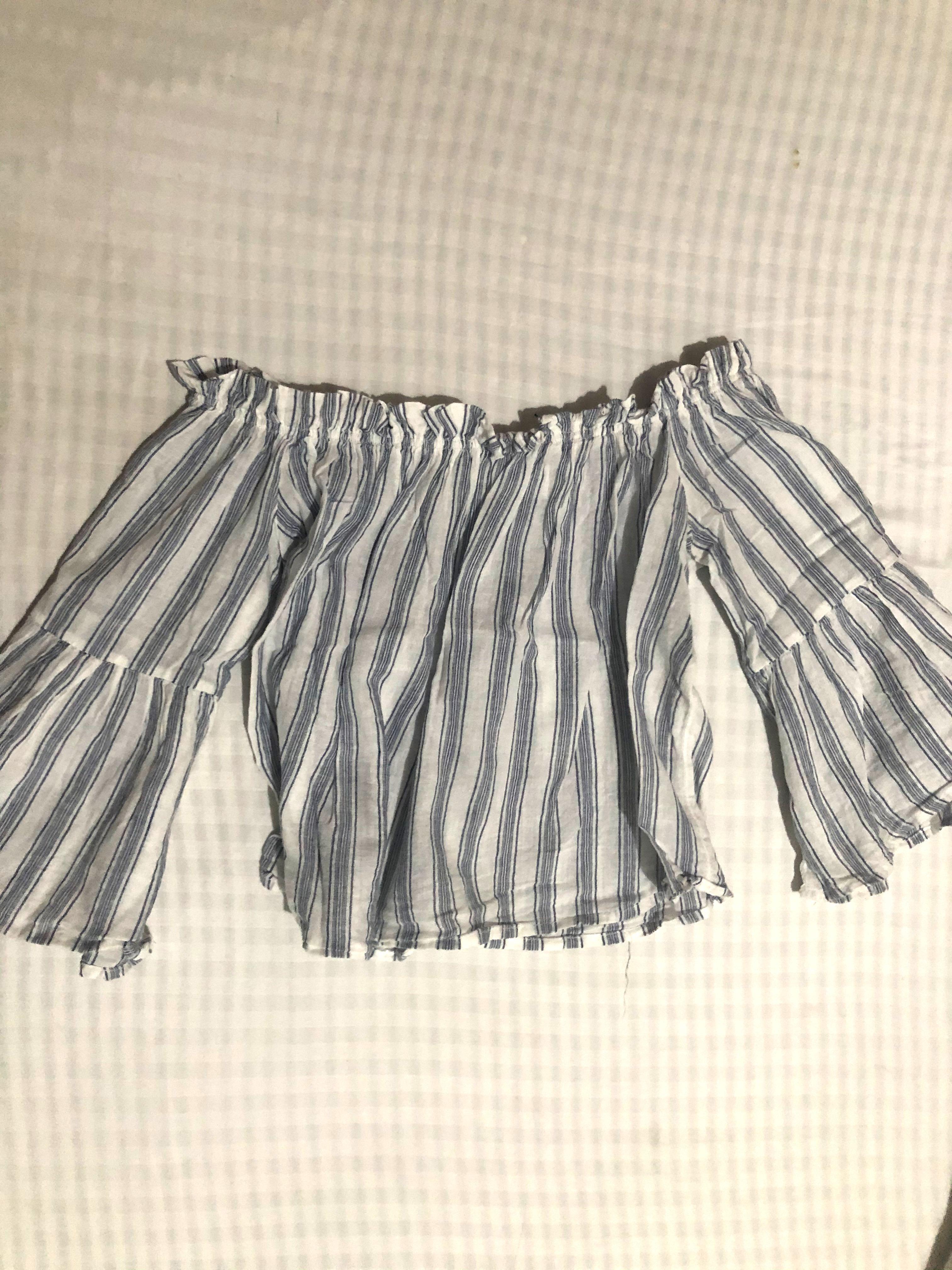 White and Blue Striped Off Shoulder Top (Category: Sleeveless) located in Quezon City. Submitted by belsclothes (Listing ID 1064385530, Image 1). Description: Barely used Garterized and stretchy Flared sleeves Fits XS-S.