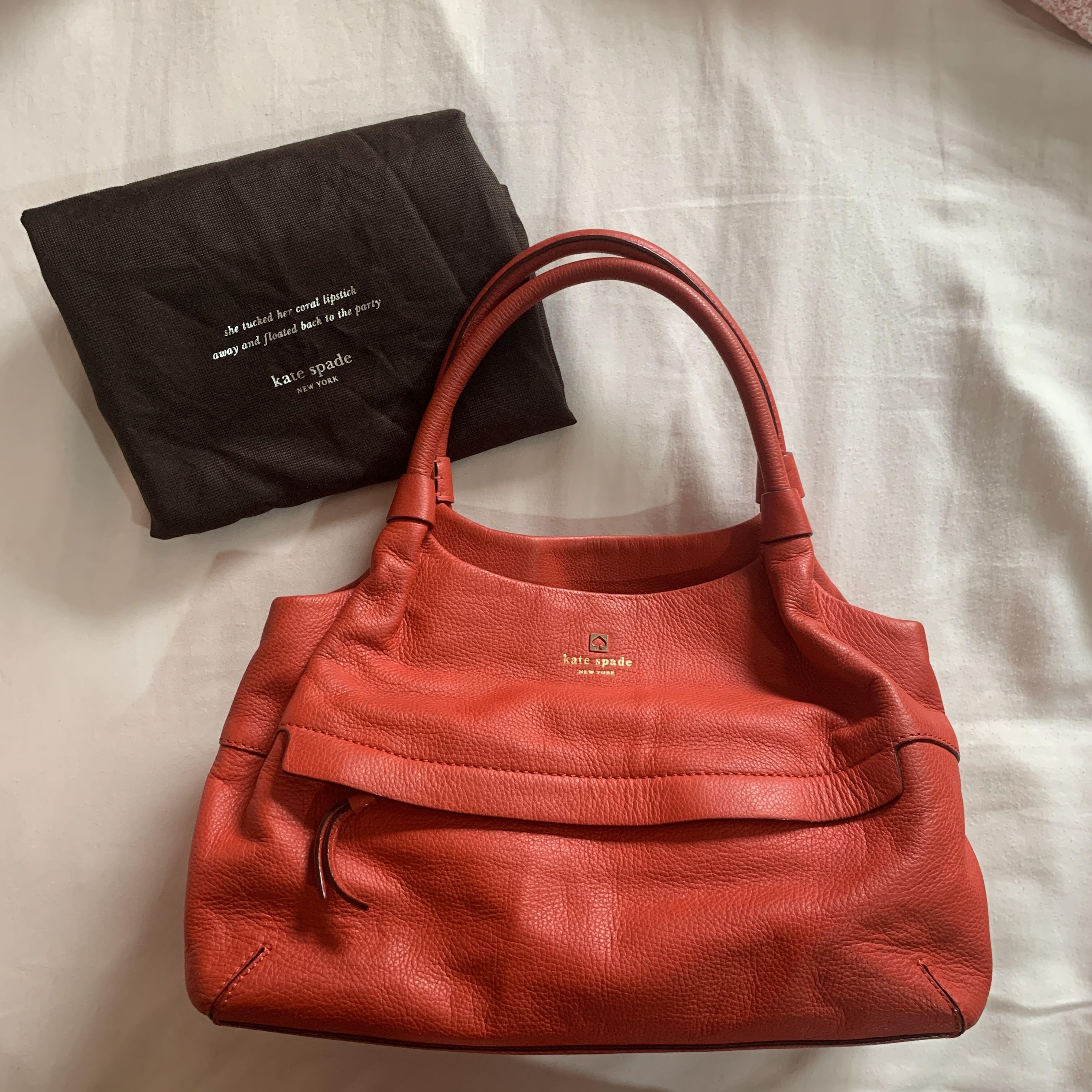 Kate Spade Stevie Grant - Coral (Category: Purses & Pouches) located in Quezon City. Submitted by mm788 (Listing ID 1064469564, Image 1). Description: Two interior compartments with a center zippered compartment. 15 inch width, 8.5 inch height.