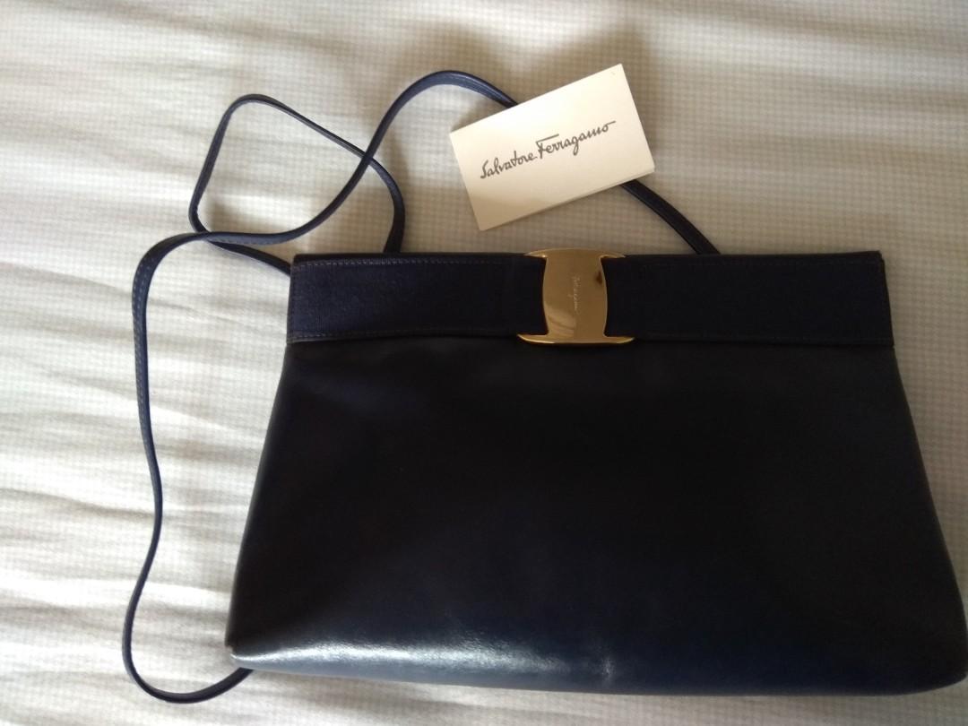 Ferragamo Cross Body/Clutch Bag (Category: Luxury Bags & Wallets) located in San Juan City. Submitted by gawed (Listing ID 1064644708, Image 2). Description: Pre-Loved Authentic Vintage Ferragamo Cross Body Bag convertible to Clutch Bag. Genuine Leather Navy Blue, in good condition with normal wear and tear as picture shown. Brass Labels are polished and clean. Great bag to bring to use in formal or informal use. Versatile. Price is negotiable. R