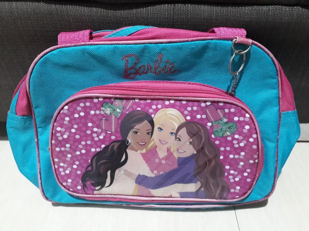 Barbie Hand Bag (Authentic) (Category: Diaper Bags & Wetbags) located in Pasig City. Submitted by identek (Listing ID 1065025254, Image 1). Description: Barbie Hand Bag (Authentic) - pre loved authentic Barbie bag - slighltly used and in good ycondition - outgrown by our daughter, not being used anymore.