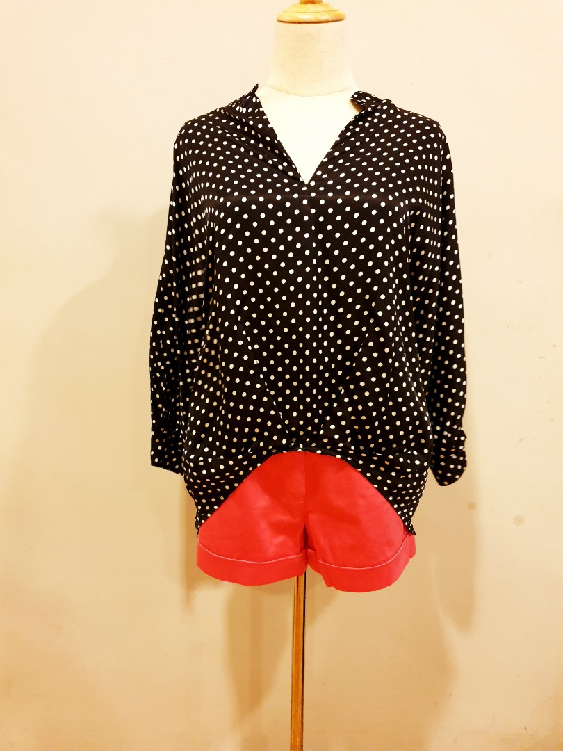 red blouse with black polka dots