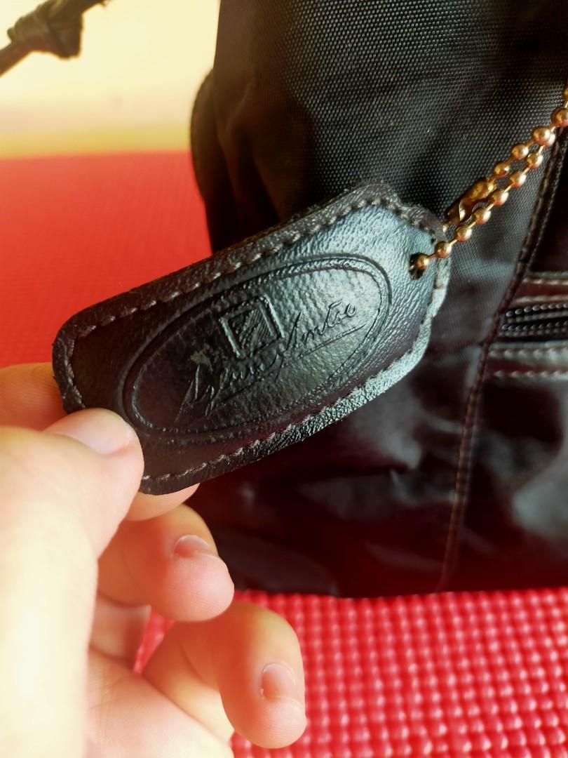 Sylvia Santos Black Hand bag (Category: Purses & Pouches) located in Quezon City. Submitted by totally_trendy (Listing ID 1064936335, Image 2). Description: Original Sylvia Santos Black Hand Bag RFS decluttering.