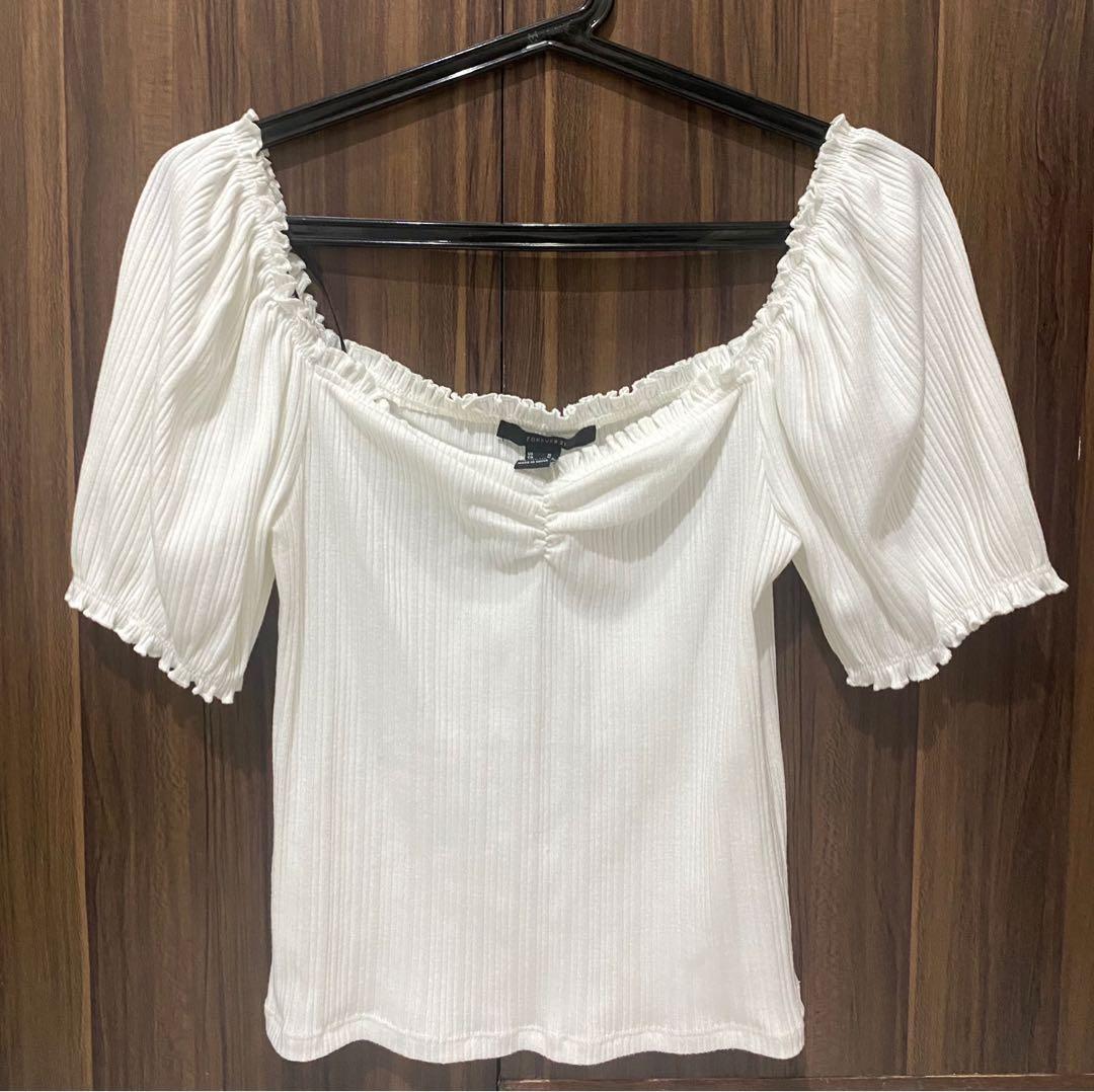 Forever 21 Puff Sleeve Top (Category: Sleeveless) located in Cebu City. Submitted by helloreza (Listing ID 1065288714, Image 1). Description: In excellent condition Used only once.