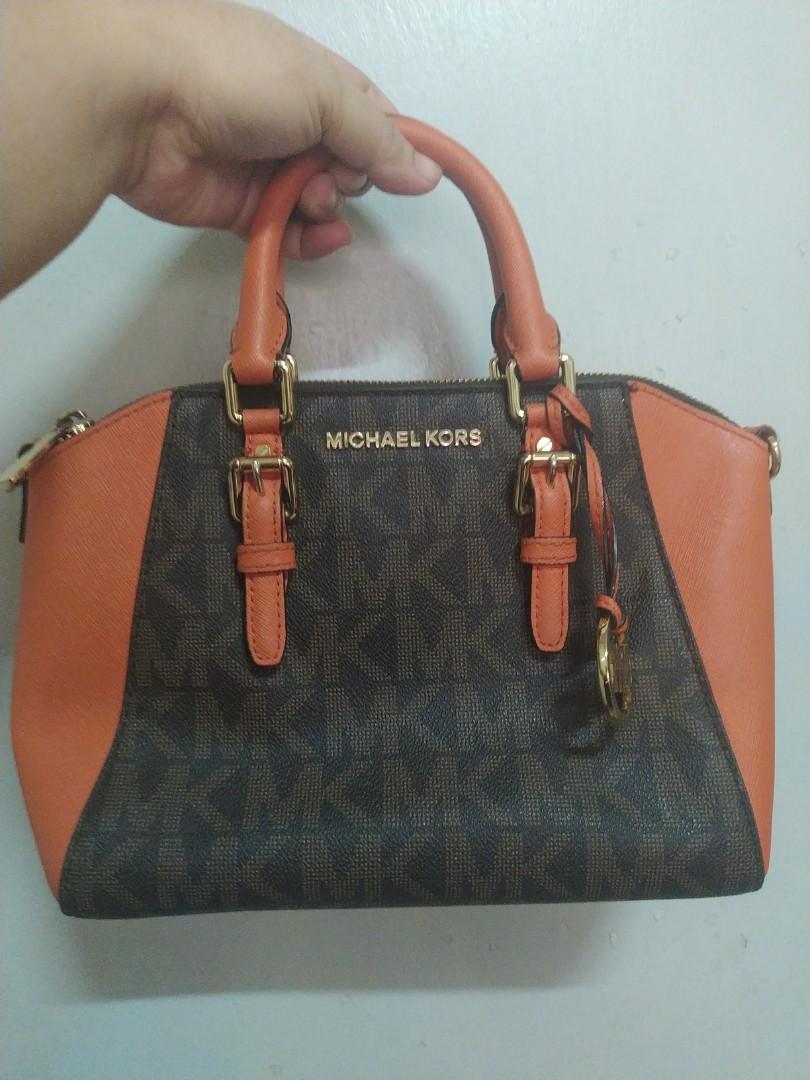 Michael Kors Tangerine Ciara two way bag (Category: Cross-body Bags) located in Quezon City. Submitted by declutteringempress (Listing ID 1065152376, Image 3). Description: 💯 authentic 📌US bought 📌signs of usage in hardwares 📌vuc 📌LP POSTED 📌first photo used as reference only #bye2020.