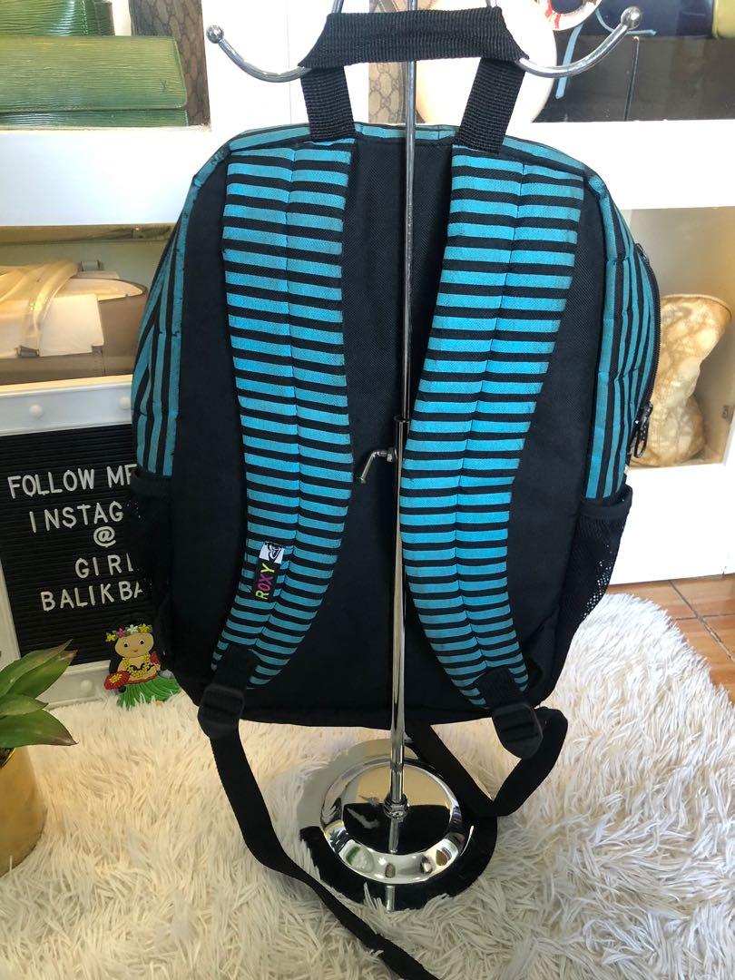 Backpack SALE‼️ Guaranteed authentic ROXY (Category: Backpacks) located in Marikina City. Submitted by girlbalikbayan (Listing ID 1065696540, Image 3). Description: We’re clearing out our shelves and selling our preloved backpacks and other bags CHEAP! Like this item - 🔘100% authentic ROXY 🔘Cool graphic design 🔘Colors of blue, black and white for the ROXY name and logo 🔘Padded shoulder straps for comfort 🔘And back is fully padded too 🔘Front