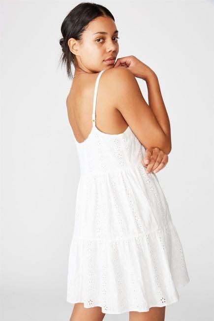 Cotton On white eyelet babydoll sleeveless dress, Women's Fashion, Tops,  Sleeveless on Carousell