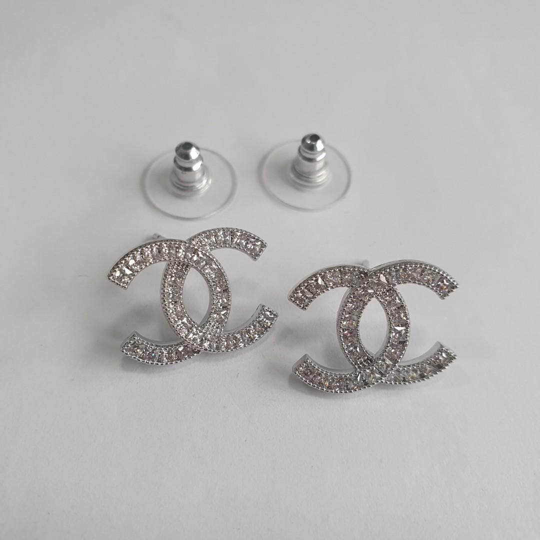 Used chanel ear stud earrings in silver tone