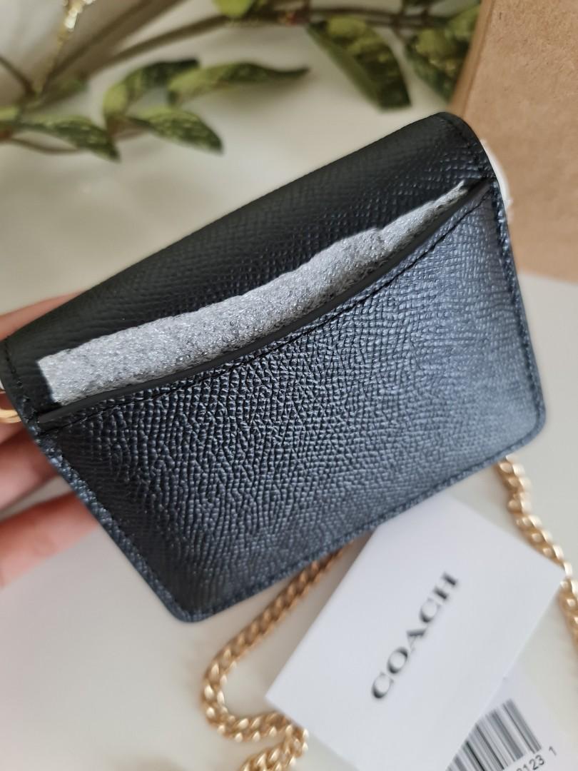 boxed mini wallet on a chain in signature canvas