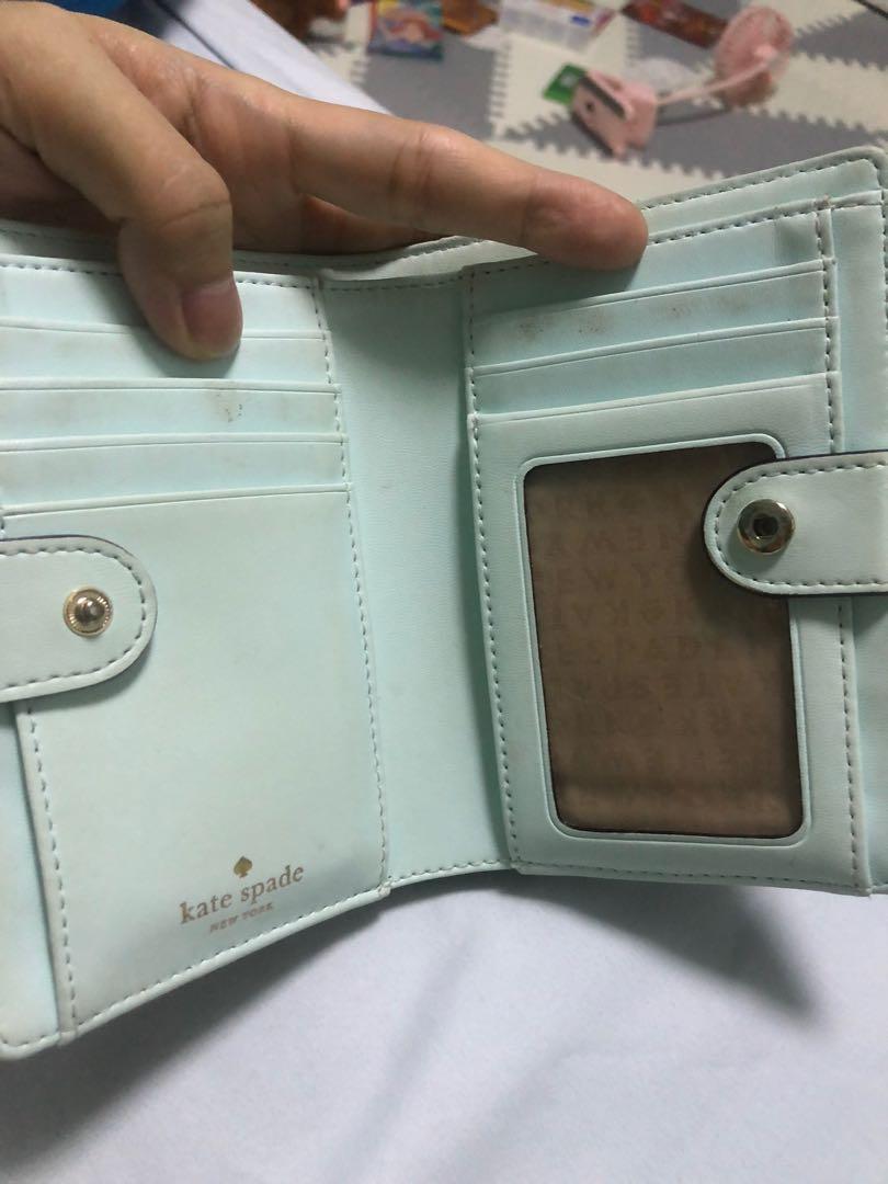 Kate spade bifold wallet (Category: Wallets & Card holders) located in Taguig. Submitted by pamraq (Listing ID 1060381549, Image 2). Description: Kate Spade Light blue bifold wallet Used condition Condition of the wallet as posted Authentic.