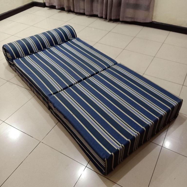 [USED] Uratex Single Foldable Sofa Bed (Category: Bed Frames & Mattresses) located in Quezon City. Submitted by bareminimalistph (Listing ID 1066232519, Image 1). Description: •Ideal solution for limited space •High-quality medium firm foam enveloped in smooth velvet fabric •Great for guests staying over •Stylish and comfortable •Built as a dual purpose decor •Measurements: 7.5x36x74inches (when spread out) 15x36x31inches (when folded) •Original 