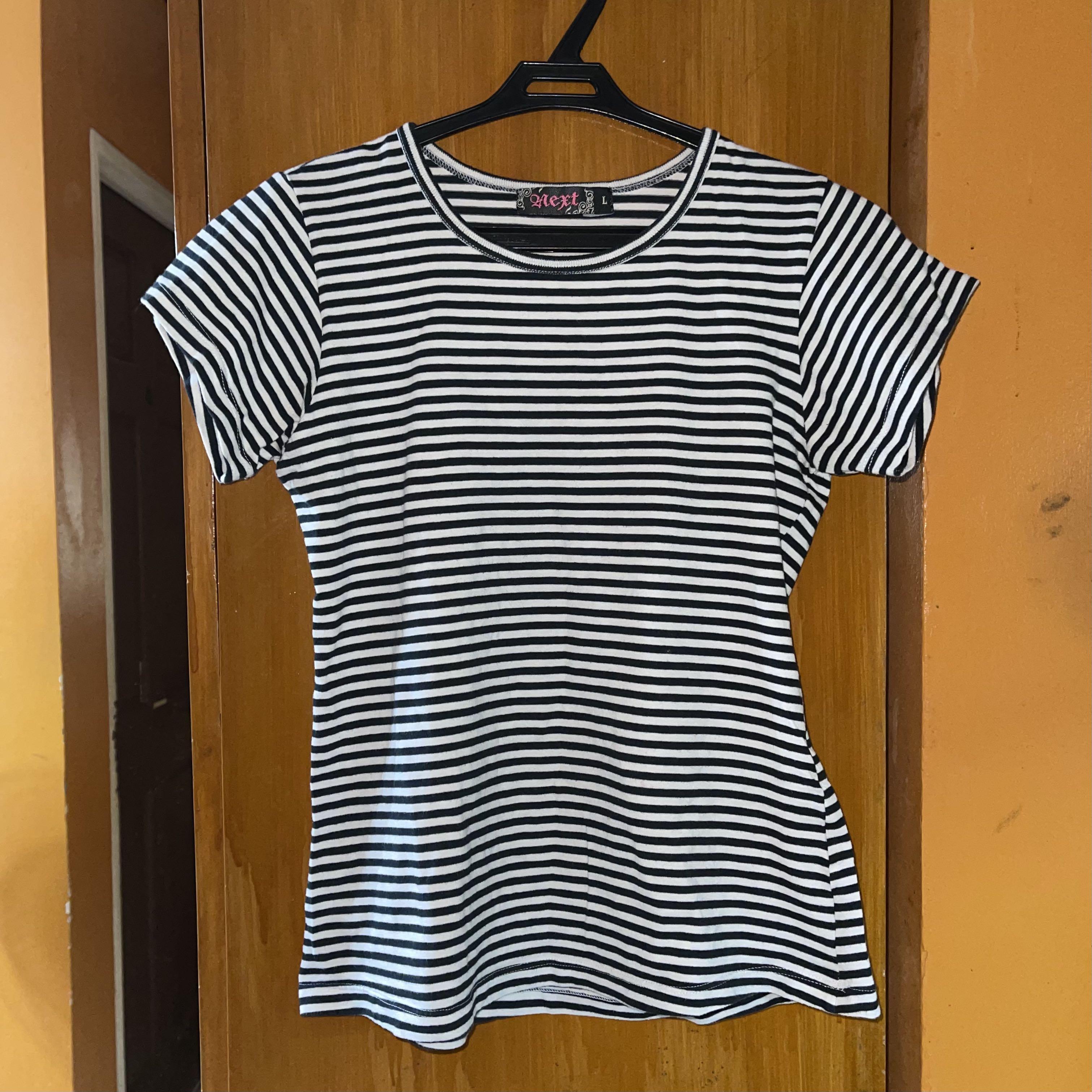 Black and White Striped Shirt (Category: Others Tops) located in Pateros City. Submitted by tauruspice (Listing ID 1060734086, Image 1). Description: Get this black and white striped shirt for only PHP100. It is in great condition and was only worn a handful of times! Very cute tucked into your favorite pair of denim jeans or white culottes. Can easily be dressed up or down! Size Large on tag but best fits XS-S. Model is a size XS with bust size 