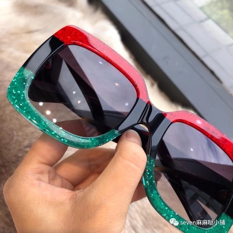 Gucci red store and green glasses