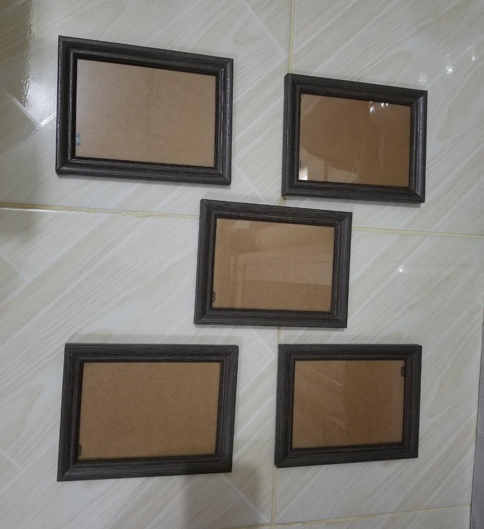 TAKE ALL 5 SMALL FRAMES (Category: Storage Boxes & Baskets) located in Quezon City. Submitted by resells_choice (Listing ID 1060766801, Image 2). Description: stand or wall frames Still in good conditions bought from SM Dept store wooden & glass material color: Dark Gray 3/4R estimated size Guaranteed good quality pick up in cubao.