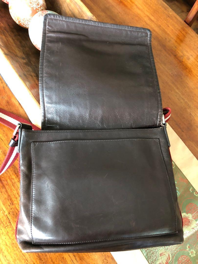 Pre-Loved BALLY Leather Messenger Bag (Category: Luxury Bags & Wallets) located in Mandaluyong City. Submitted by rigel.rempola (Listing ID 1060910988, Image 2). Description: Authentic pre-owned BALLY calf skin leather messenger bag including cloth dust bag, plastic cover bag, large paper bag, authenticity cards, and original price tag from Duty Free Philippines. All hardware is intact; the interior lining of the bag is intact and undamaged; the 