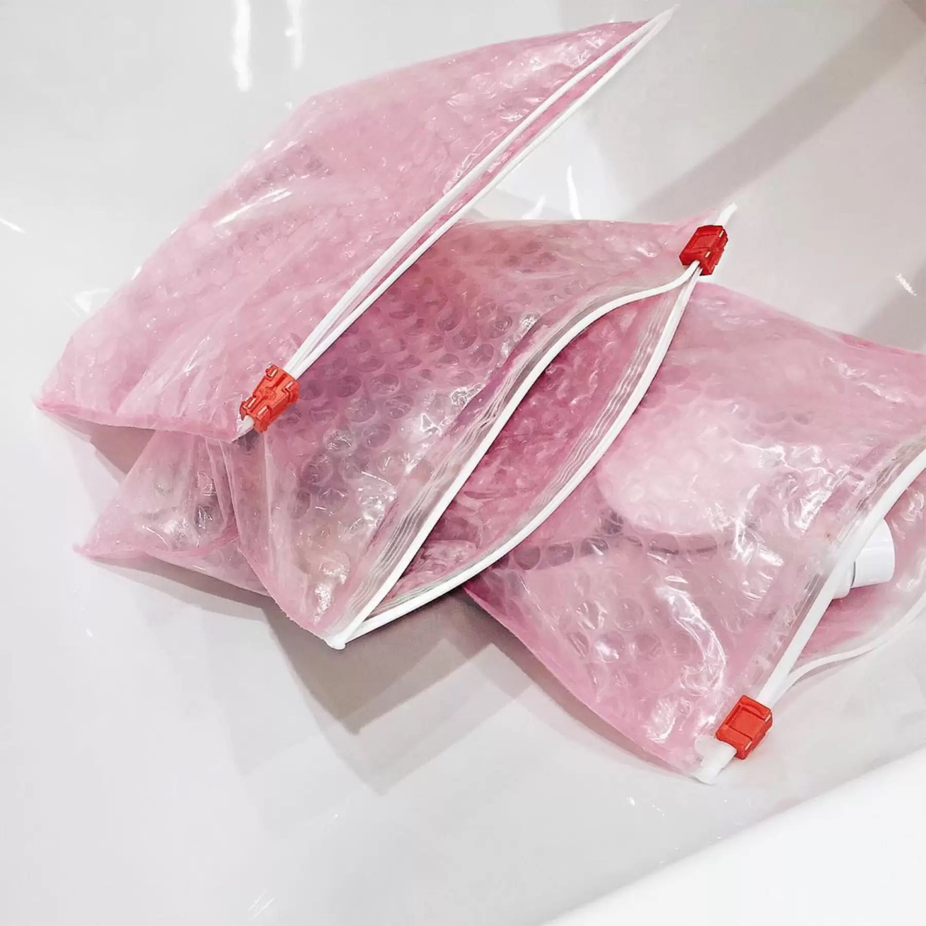 Glossier pink bubble pouch 2025