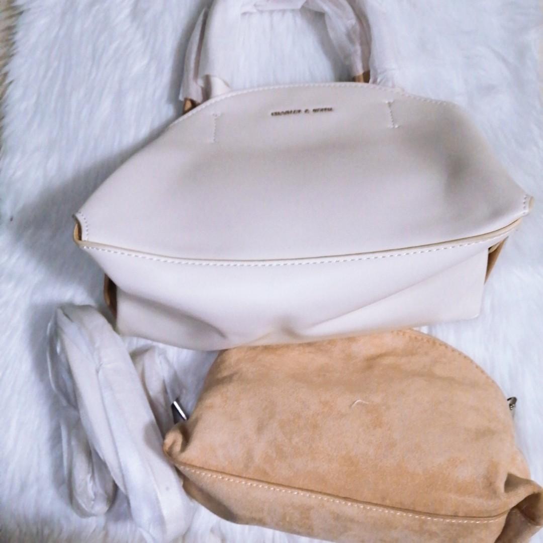 Charles and keith 2 white and tan (Category: Beach Bags) located in Pasay City. Submitted by wardrobe_clearing (Listing ID 1061624757, Image 2). Description: Brand new With dust bag Mall pullout.