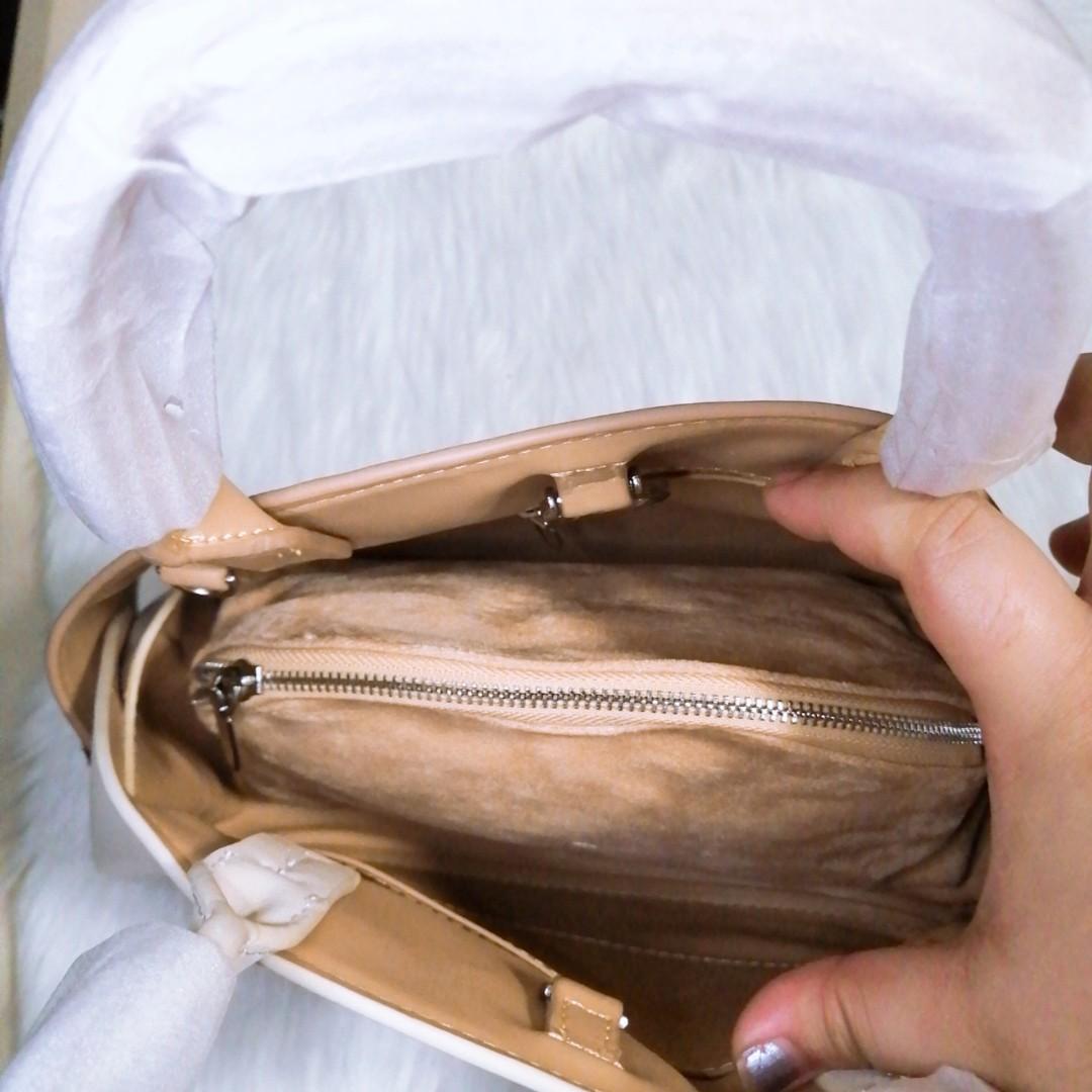 Charles and keith 2 white and tan (Category: Beach Bags) located in Pasay City. Submitted by wardrobe_clearing (Listing ID 1061624757, Image 3). Description: Brand new With dust bag Mall pullout.