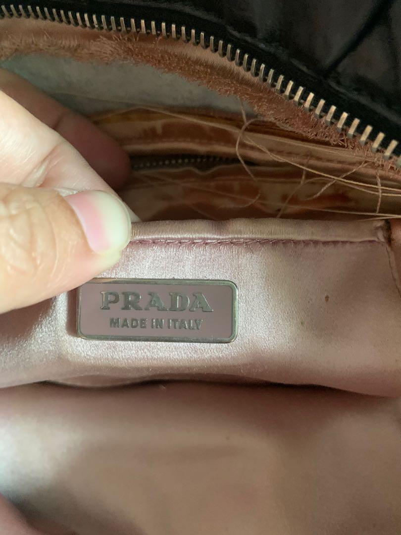 Prada envelope bag (Category: Luxury Bags & Wallets) located in Makati City. Submitted by myterry1941 (Listing ID 1061572594, Image 3). Description: Comes with dust bag and bag Please check condition of the interior of the bag before making an offer Interior lining needs to be sewn Authenticity cards and tag included .