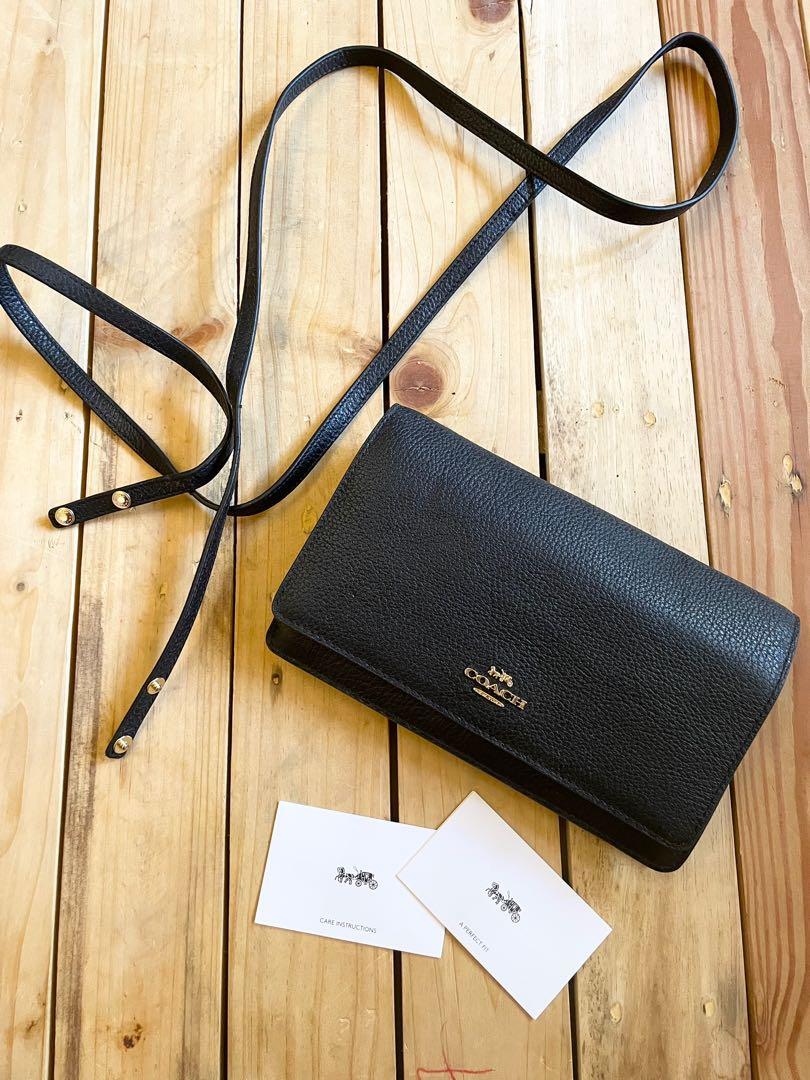Coach flap wallet on chain (Category: Luxury Bags & Wallets) located in Lipa City. Submitted by lifestyled (Listing ID 1116865007, Image 1). Description: Brand new and unused Coach flap wallet on chain With Detachable long straps With multiple card slots and zipped compartment Can double as purse Black grossgrain leather 💯 Authentic Note: has been on storage with some minor scuffs on the inner flap and corner (refer to pic) .