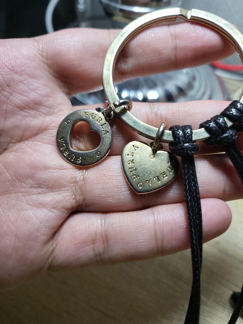 Furla Large Keychain Charm (Category: Luxury Accessories) located in Taguig. Submitted by jbsmen (Listing ID 1118806917, Image 3). Description: Old item. Gold plate has faded but still useful. Item can be used as a bag charm, keychain or a necklace.