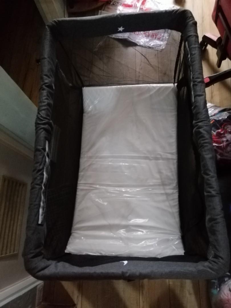 Lotus travel crib backpack sales