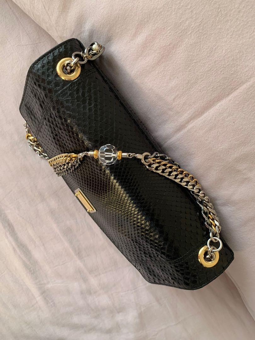 D&G Miss Charles Python clutch/shoulder bag (Category: Luxury Bags & Wallets) located in Taguig. Submitted by zablaza (Listing ID 1119590125, Image 3). Description: Rare authentic D&G Miss Charles python clutch/shoulder bag w/ crystal faux-pearl embellished chain. Red satin interior lining w/ single interior pocket & snap closure at front flap. Excellent pre-owned condition. Comes w/ dust bag & authenticity card..
