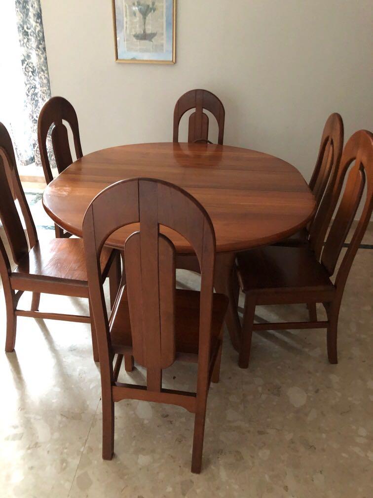 Extendable dining table (Category: Tables & Sets) located in Singapore. Submitted by booklvr (Listing ID 1119624801, Image 3). Description: Round table with six chairs, extends to oval. Solid wood, a few small scratches. Self collect CCK. Available mid November. Leaving the country. .