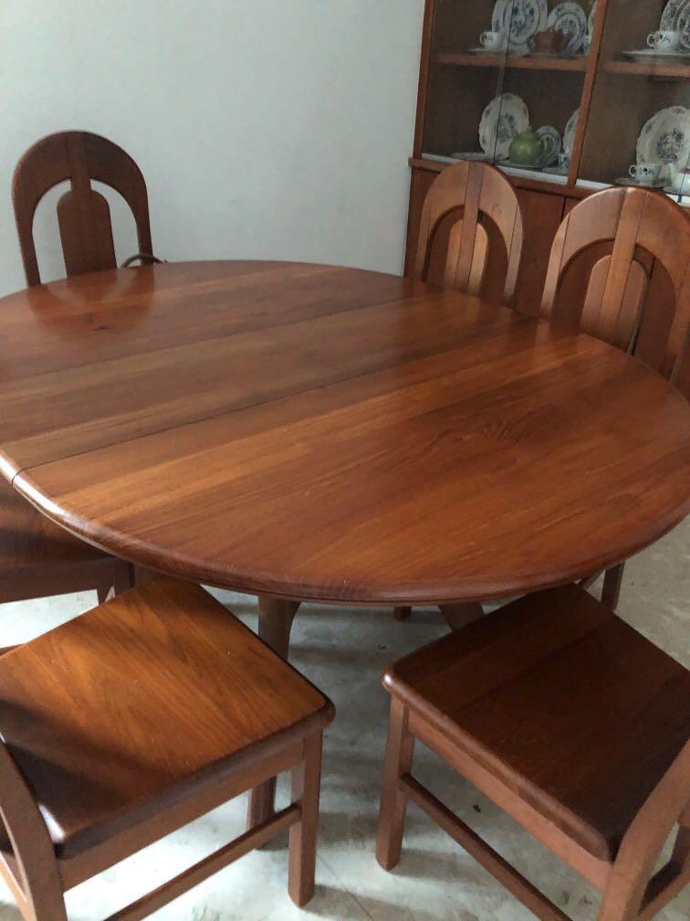 Extendable dining table (Category: Tables & Sets) located in Singapore. Submitted by booklvr (Listing ID 1119624801, Image 2). Description: Round table with six chairs, extends to oval. Solid wood, a few small scratches. Self collect CCK. Available mid November. Leaving the country. .