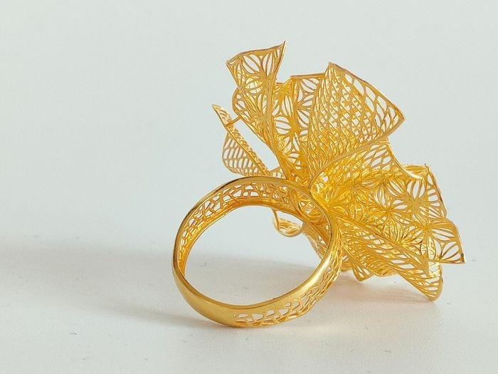 Gold ring in flower design best sale