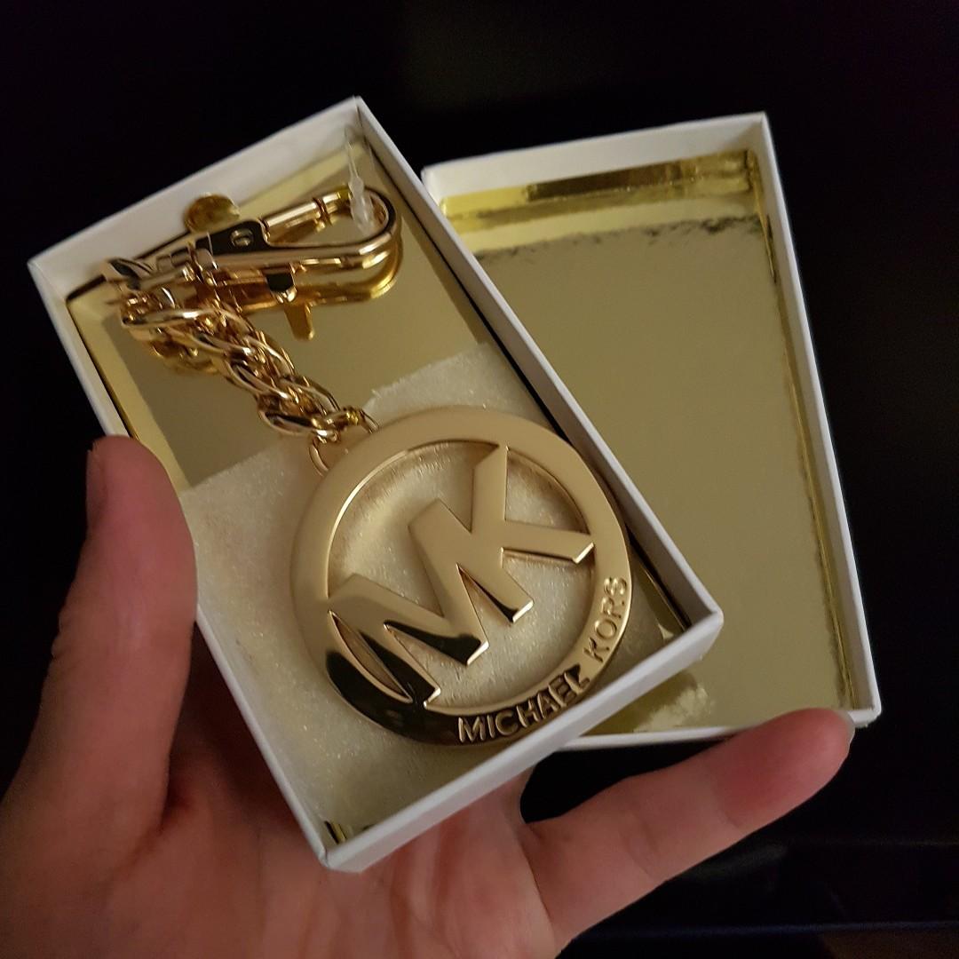 MICHAEL KORS KEY CHAIN CUM BAG CHARM IN GOLDTONE HARDWARE - AUTHENTIC,  Luxury, Accessories on Carousell