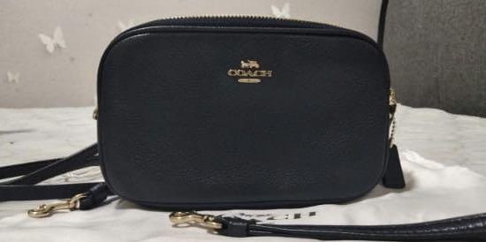 Coach sadie hotsell crossbody clutch black