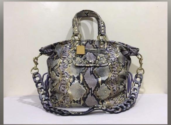 Coach two way python embossed (Category: Luxury Bags & Wallets) located in Quezon City. Submitted by mamacons (Listing ID 1119997496, Image 1). Description: COACH EXOTIC POPPY XL SPOTLIGHT PYTHON EMBOSSED 💯 % original .