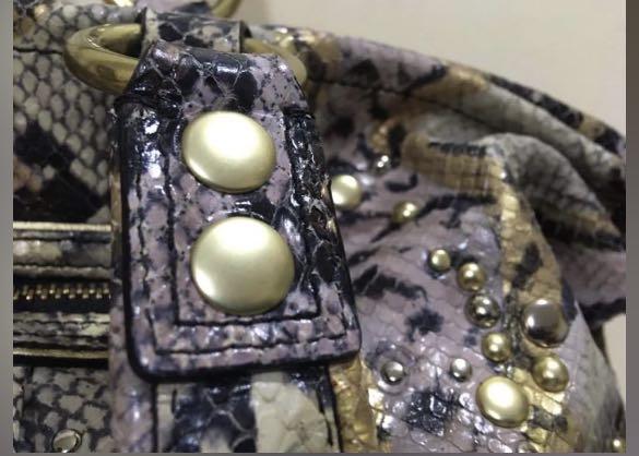 Coach two way python embossed (Category: Luxury Bags & Wallets) located in Quezon City. Submitted by mamacons (Listing ID 1119997496, Image 3). Description: COACH EXOTIC POPPY XL SPOTLIGHT PYTHON EMBOSSED 💯 % original .