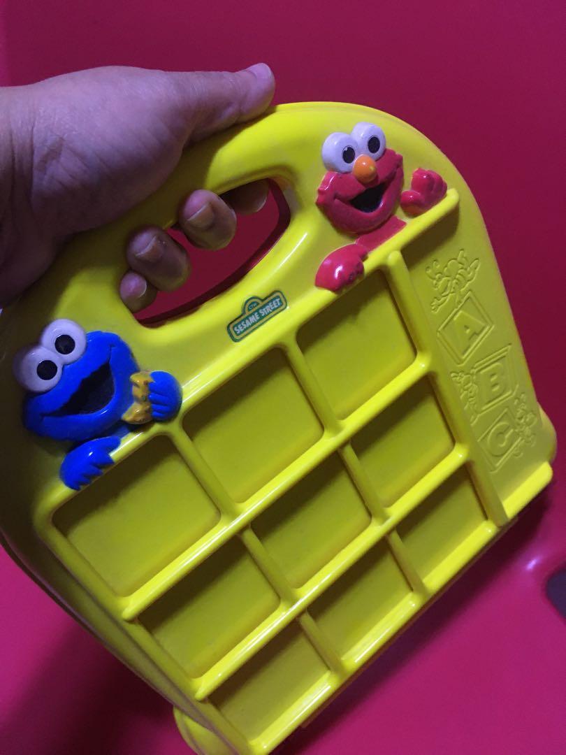 Sesame street educational toy (Category: Educational & Learning Toys) located in Pasig City. Submitted by ramscleanup (Listing ID 1119896589, Image 2). Description: 24 pcs square thingies (letters and numbers… back to back) Take along toy .