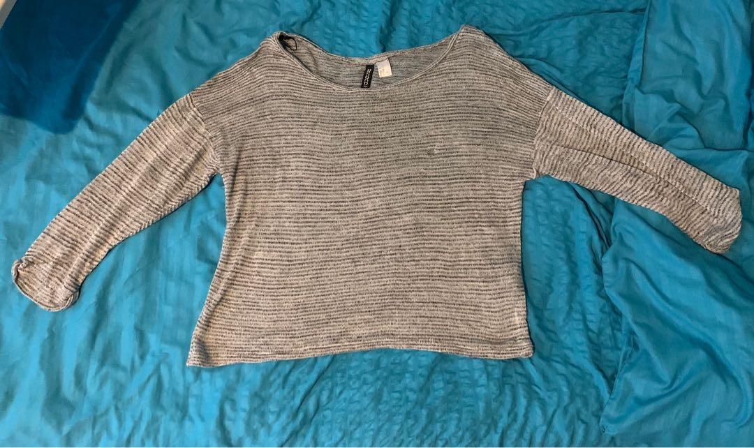 H&M Grey Sweatshirt (Category: Longsleeves) located in Quezon City. Submitted by nmdeclutters (Listing ID 1120253830, Image 1). Description: Loose fit! Could be worn many different ways: Sweatshirt for working out Beach coverup Worn as is Has holes See images Shipping c/o buyer.
