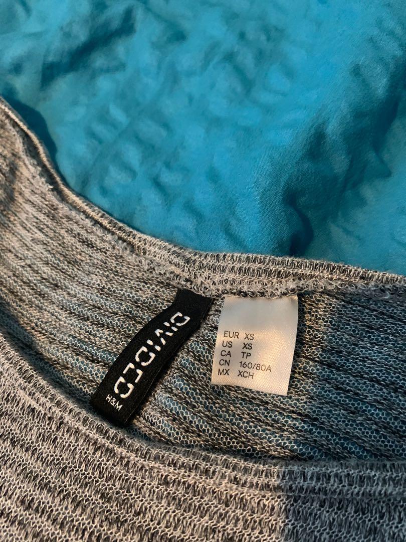 H&M Grey Sweatshirt (Category: Longsleeves) located in Quezon City. Submitted by nmdeclutters (Listing ID 1120253830, Image 2). Description: Loose fit! Could be worn many different ways: Sweatshirt for working out Beach coverup Worn as is Has holes See images Shipping c/o buyer.