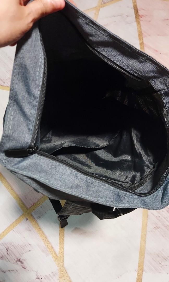 Backpack (Category: Backpacks) located in Singapore. Submitted by nandyp (Listing ID 1120560067, Image 4). Description: JP Morgan backpack, top zip closure, fold over with buckle closure for added security. Inside there is a pocket for laptops. in front there is a zipped compartment. Cleaning house. never used this bag before. in mint condition. no marking whatsoever on it. 50cm length (once top is folded and buckled), 36cm width approx. no nego.