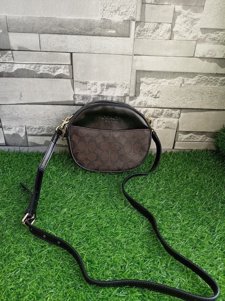 Coach round sling bag, Luxury, Bags & Wallets on Carousell