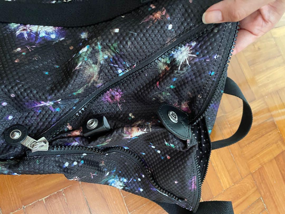 Kipling multi usage bag (Category: Tote Bags) located in Singapore. Submitted by thepinkbubble (Listing ID 1117025159, Image 3). Description: Versatile bag that is expandable Back can slip onto luggage handle Base length 44cm Width 18cm Height 37cm.