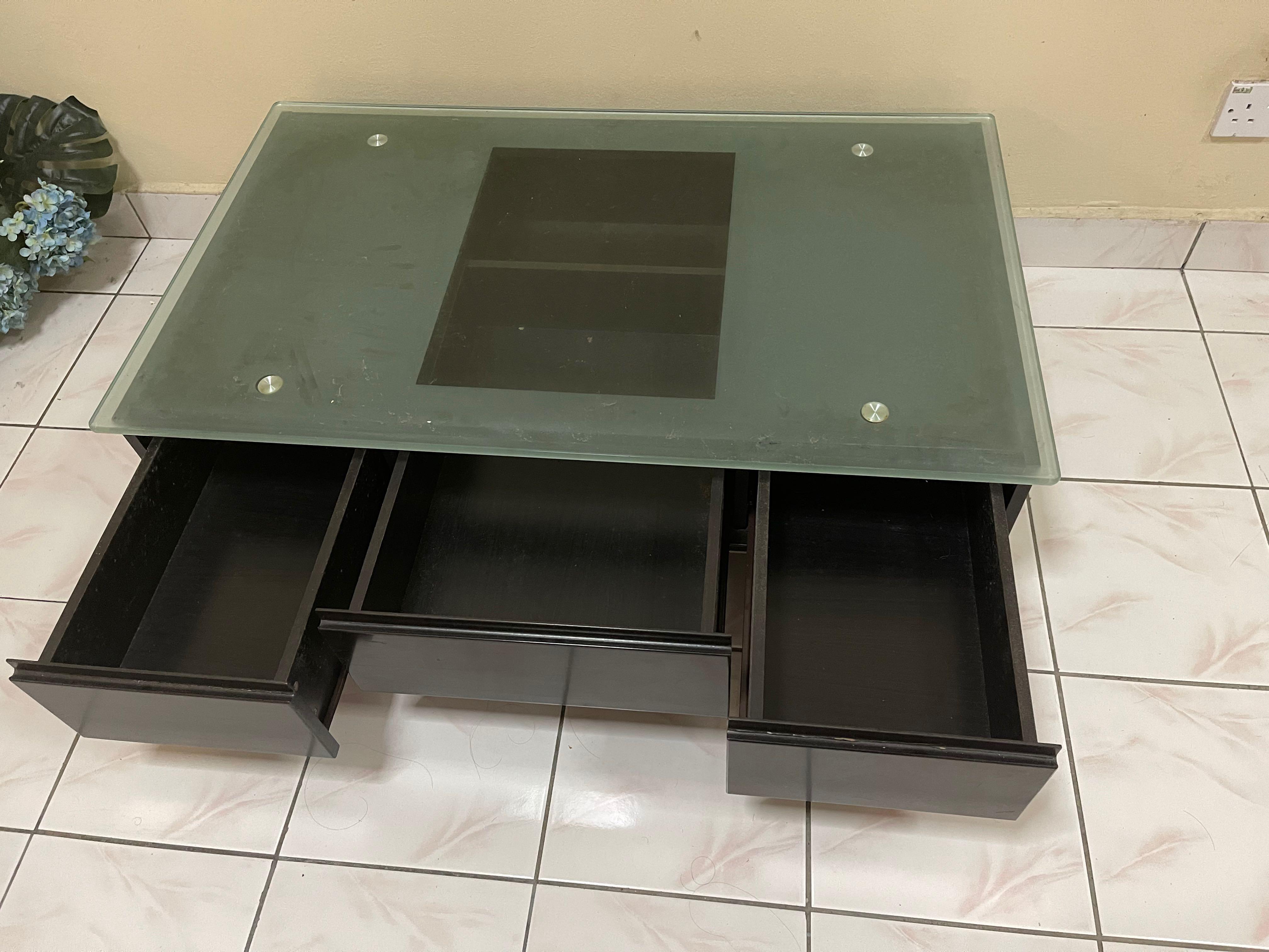 Coffee table (Category: Tables & Sets) located in Kuala Lumpur. Submitted by syhrlamrh (Listing ID 1120955549, Image 2). Description: Black Glass Wood coffee table for sale Metal leg & frame Weight roughly 50-80kg Buyer to arrange pickup / delivery Can be nego.