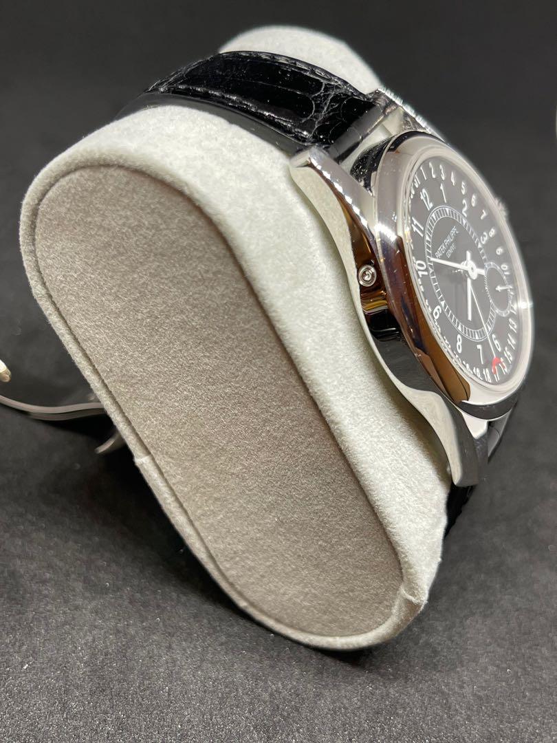 Patek Philippe Calatrava 6000G-001 (Category: Watches) located in Singapore. Submitted by thehandsoftime (Listing ID 1121078356, Image 2). Description: Pre-Owned Patek Philippe Calatrava (6000G001) self-winding automatic watch, features a 37mm 18k white gold case surrounding a black dial on a black alligator strap with an 18k white gold Chevron deployant buckle. Functions include hours, minutes, small seconds and date. Complete Box and papers.