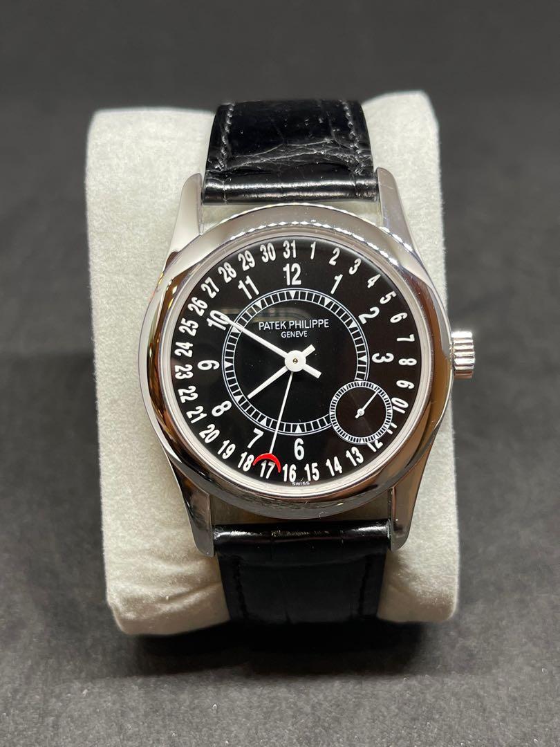 Patek Philippe Calatrava 6000G-001 (Category: Watches) located in Singapore. Submitted by thehandsoftime (Listing ID 1121078356, Image 1). Description: Pre-Owned Patek Philippe Calatrava (6000G001) self-winding automatic watch, features a 37mm 18k white gold case surrounding a black dial on a black alligator strap with an 18k white gold Chevron deployant buckle. Functions include hours, minutes, small seconds and date. Complete Box and papers.