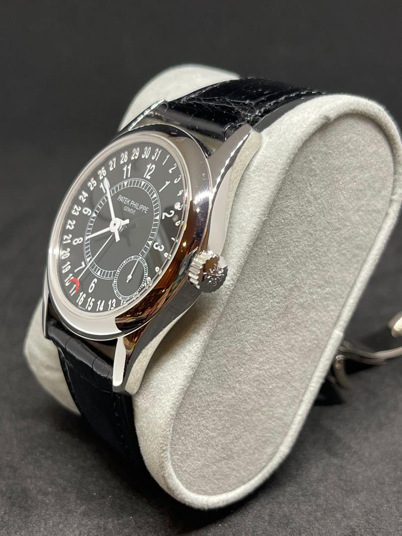 Patek Philippe Calatrava 6000G-001 (Category: Watches) located in Singapore. Submitted by thehandsoftime (Listing ID 1121078356, Image 3). Description: Pre-Owned Patek Philippe Calatrava (6000G001) self-winding automatic watch, features a 37mm 18k white gold case surrounding a black dial on a black alligator strap with an 18k white gold Chevron deployant buckle. Functions include hours, minutes, small seconds and date. Complete Box and papers.