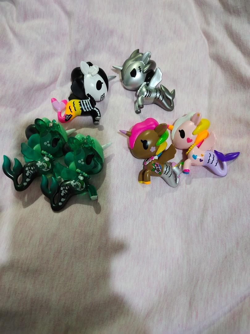 Tokidoki Mermicorno Series 1, 2, 3/Neon Star Deluxe/Donutella and Her Sweet Friends (Category: Toys & Games) located in Singapore. Submitted by lambentflicker (Listing ID 1121318764, Image 2). Description: Mermicorno Series 1 - $30 Marea Gelatina Corsica Marina Oceania Mermicorno Series 2 - $30 Sharkbite - Chaser* Fantasma SOLD Cerulean Lei-la Perlina Mermicorno Series 3 - $25 Sailor Neon Star Deluxe - $25($175 set price) Lilapessa SOLD DJ Sparkl