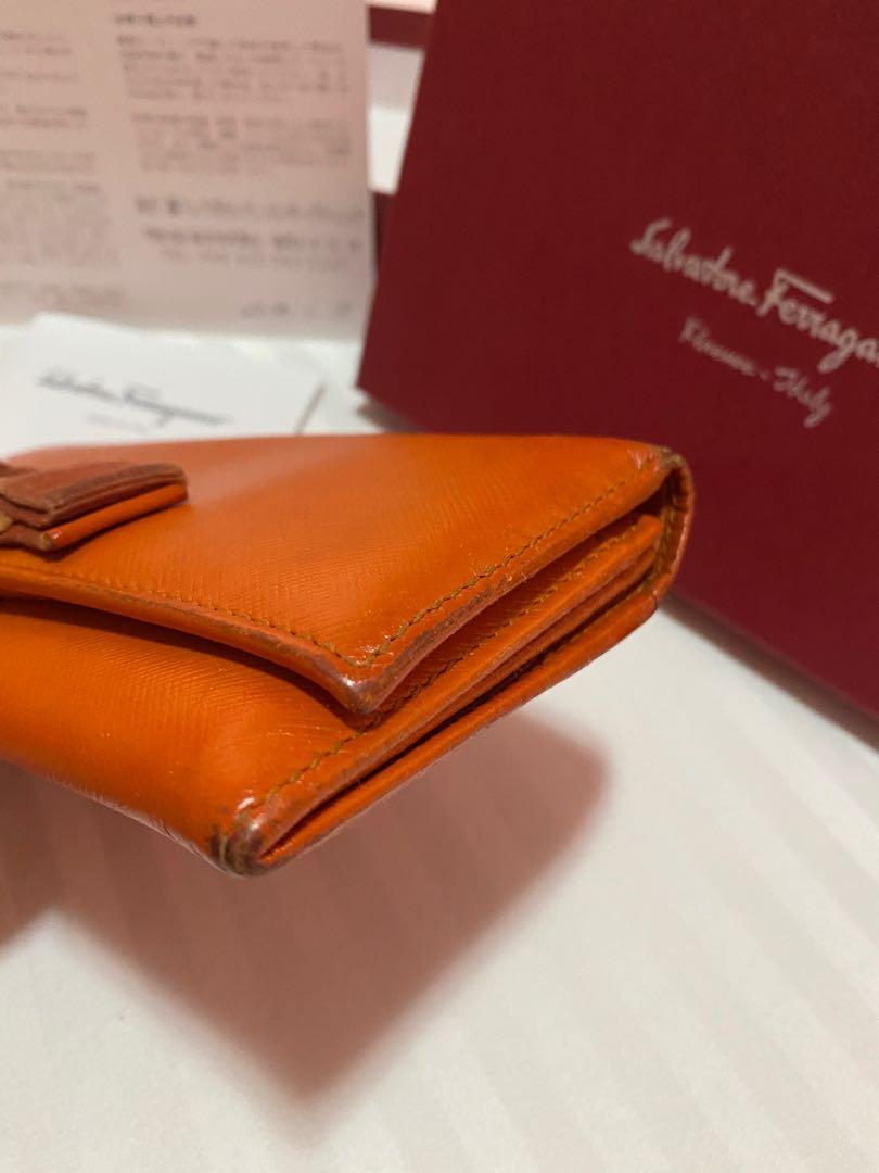FASTBREAK! Salvatore Ferragamo Wallet (Category: Luxury Bags & Wallets) located in San Fernando. Submitted by thehamiltonqueen (Listing ID 1121415299, Image 3). Description: Original Salvatore Ferragamo Long Wallet Color:Orange Hardware: Gold Inclusion: Box,Tissue Wrap,Cards, and barcode Signs of Usage: Oxidized corners, darkened front ribbon, and scratches on the hardware Recommend to have this bag spa to bring bag its beauty. No stickiness, no 
