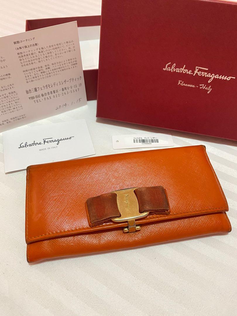 FASTBREAK! Salvatore Ferragamo Wallet (Category: Luxury Bags & Wallets) located in San Fernando. Submitted by thehamiltonqueen (Listing ID 1121415299, Image 1). Description: Original Salvatore Ferragamo Long Wallet Color:Orange Hardware: Gold Inclusion: Box,Tissue Wrap,Cards, and barcode Signs of Usage: Oxidized corners, darkened front ribbon, and scratches on the hardware Recommend to have this bag spa to bring bag its beauty. No stickiness, no 