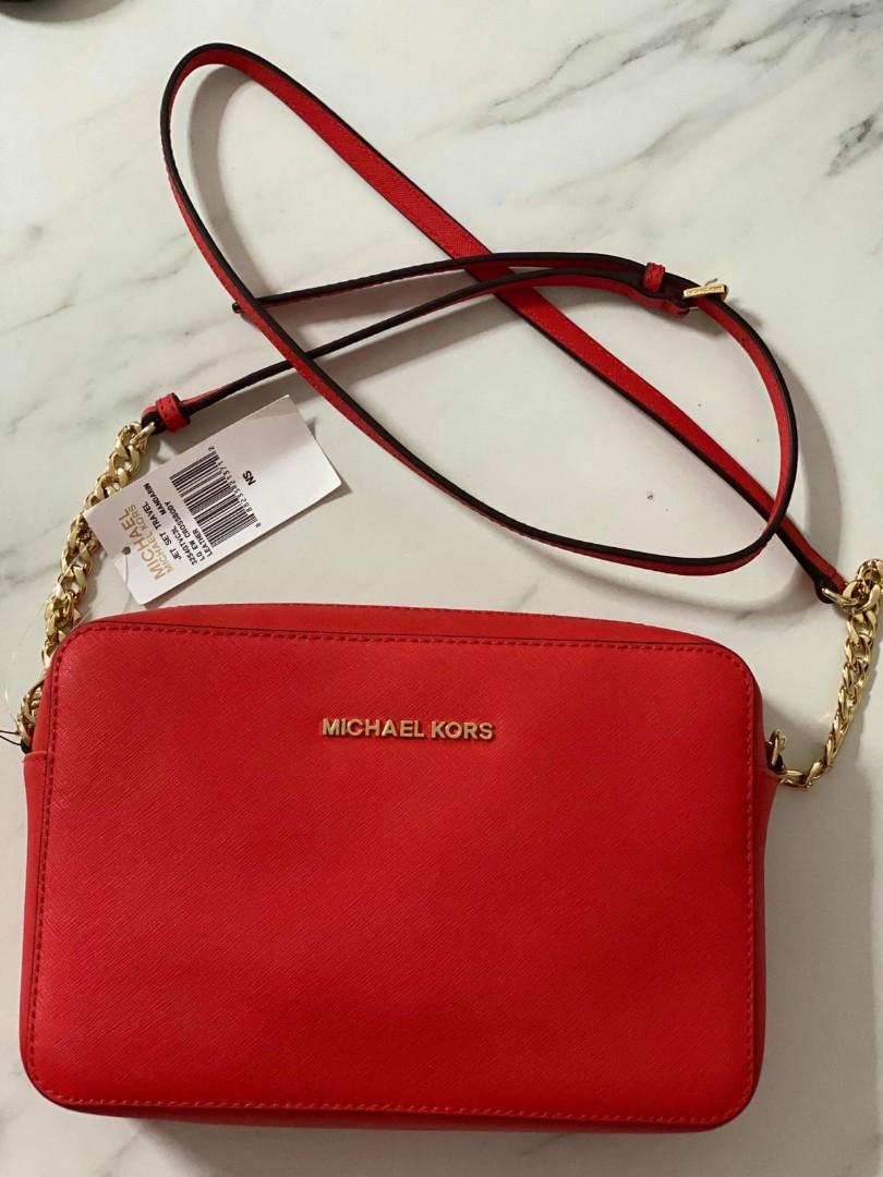 Authentic MK red sling bag