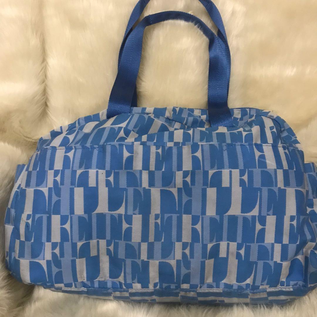 Elle Paris Medium Travel Bag (Category: Luxury Bags & Wallets) located in Manila. Submitted by shopaholic_gurl (Listing ID 1121727179, Image 3). Description: In preloved condition Shows normal signs of usage Mini travel bag Zipper enclosed compartments Sold as is.