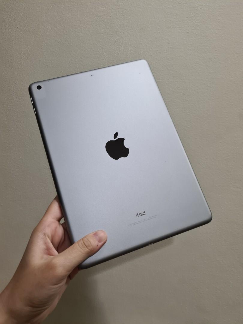 Apple iPad Space Gray 5th Gen 32GB Wifi (Category: iPad) located in Pasig City. Submitted by clothesandthings_ (Listing ID 1121851976, Image 2). Description: with box no cable issues: none (functionality), slight dent on corners and scratches on sides, back flawless, screen with red mark on black screen (see photo) original price around 25k.