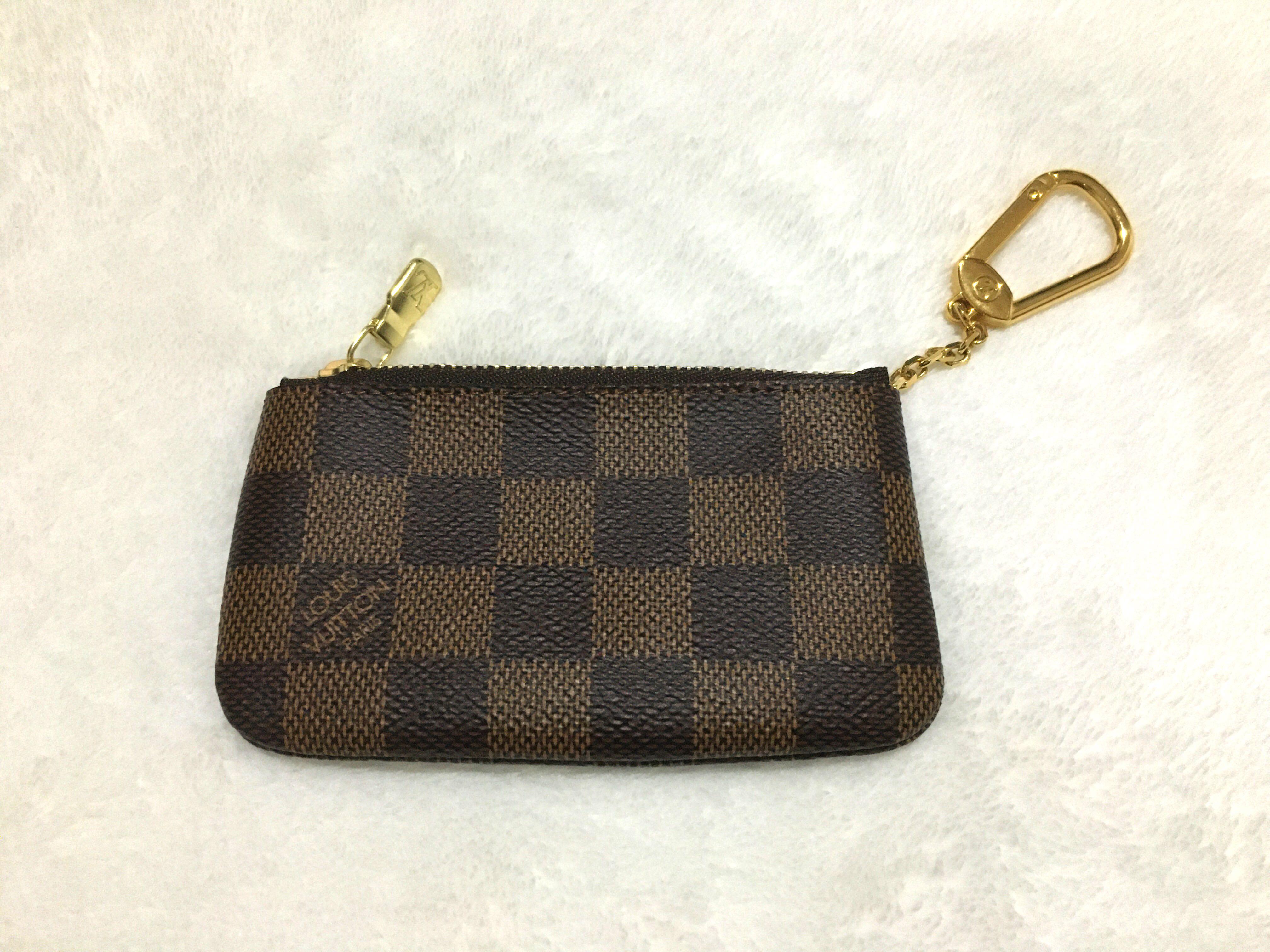 LV Cles Damier Ebene (Category: Luxury Bags & Wallets) located in Rizal. Submitted by raine.1124 (Listing ID 1121815512, Image 2). Description: Louis Vuitton Cles in Damier Ebene ▫️ Excellent Condition, used once only. ▫️ Complete packaging - dust bag, box, gift receipt and paper bag ▫️ Shipping Fee excluded.